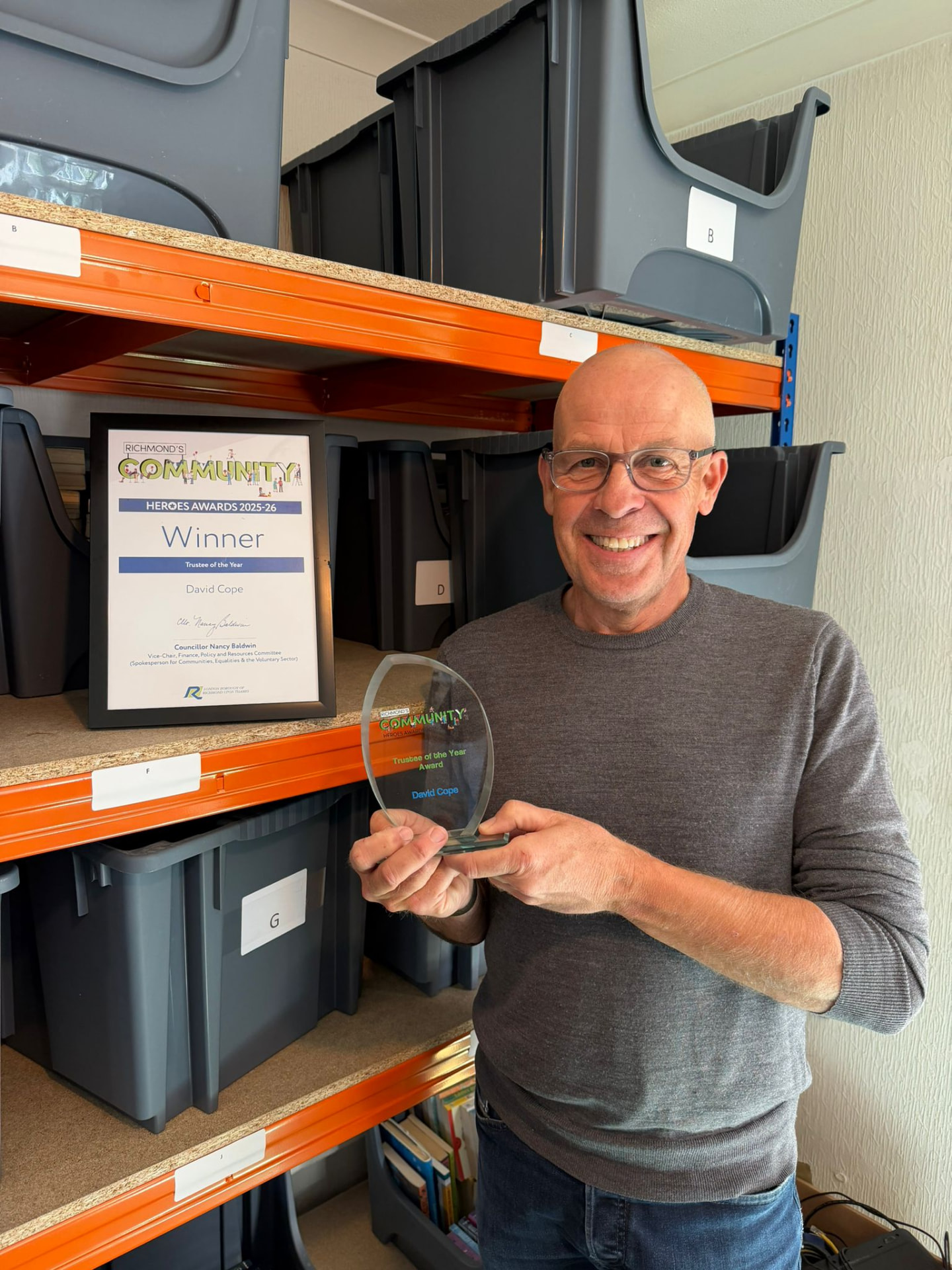 David Cope holding his Richmond's Community Heroes Awards Trustee of the Year trophy